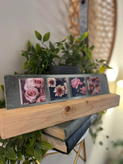 Decorative magnets with floral designs on a wooden stand, surrounded by plants.